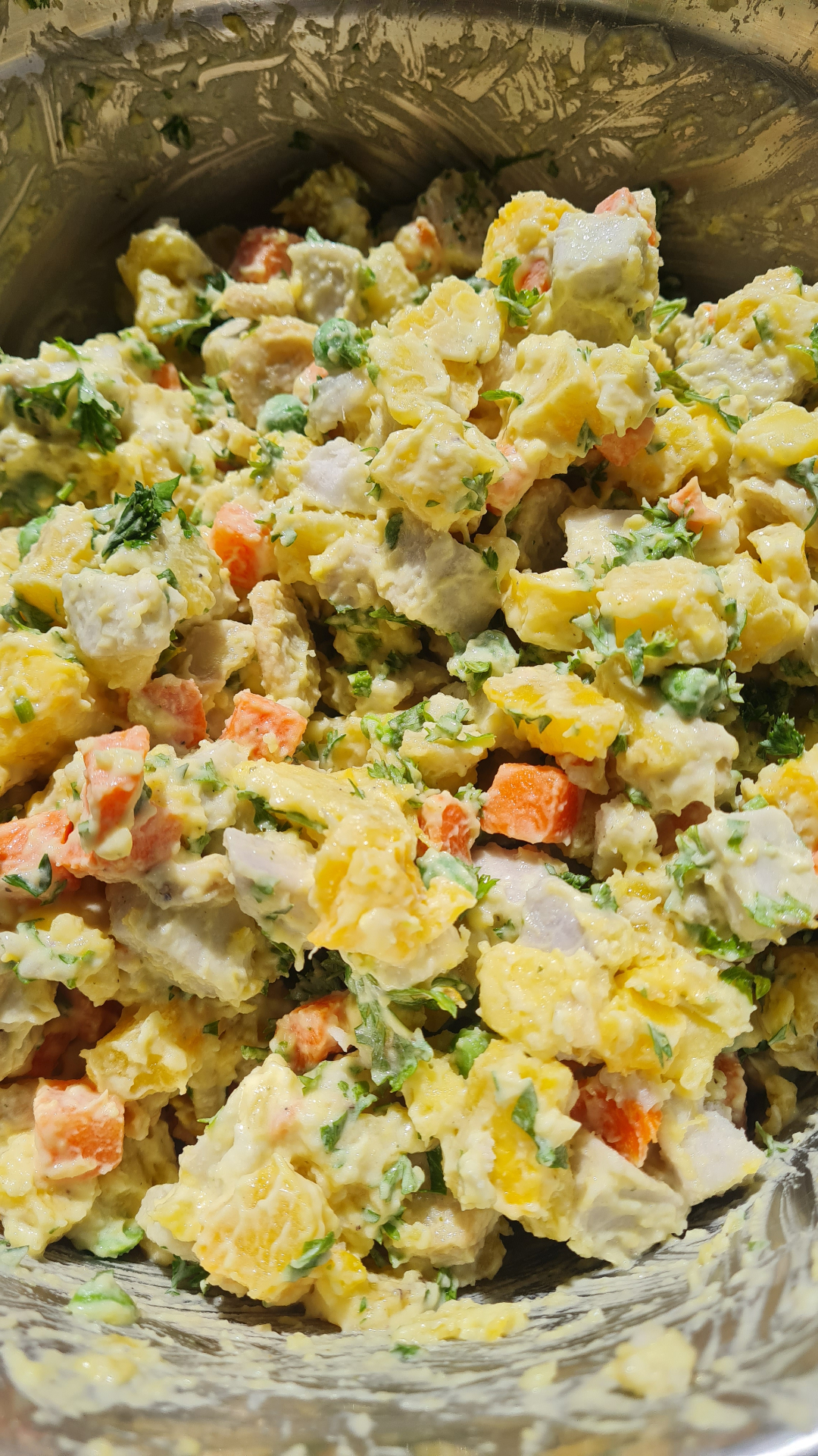 Caribbean potato salad with peas, carrots and fresh herbs